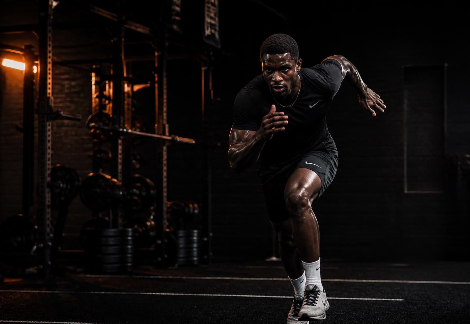 Footballer sprinting during a performance gym session